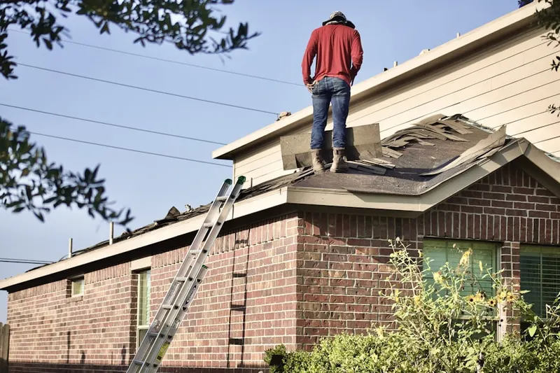 Professional roofer working on a residential roof in Fox River Shores